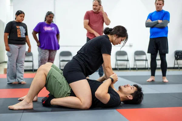 Madison Journey BJJ students drilling mount choke defenses during scenario training lab