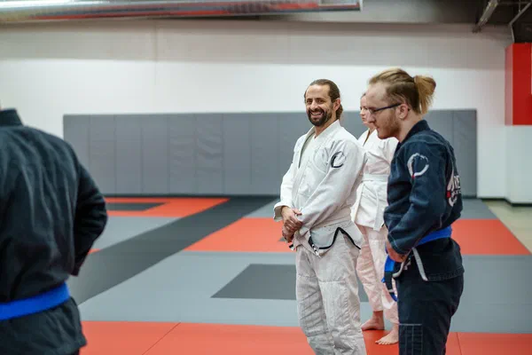 Adult gi student smiling at camera at Journey BJJ Madison