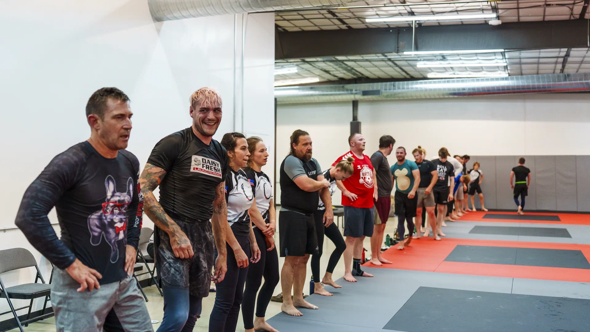 A lineup of jiu jitsu students at the end of a fun brazilian jiu jitsu no gi class