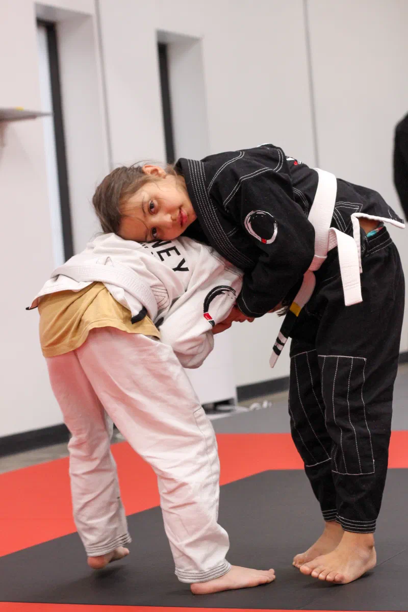 kids having fun rolling in jiu jitsu class in Madison WI