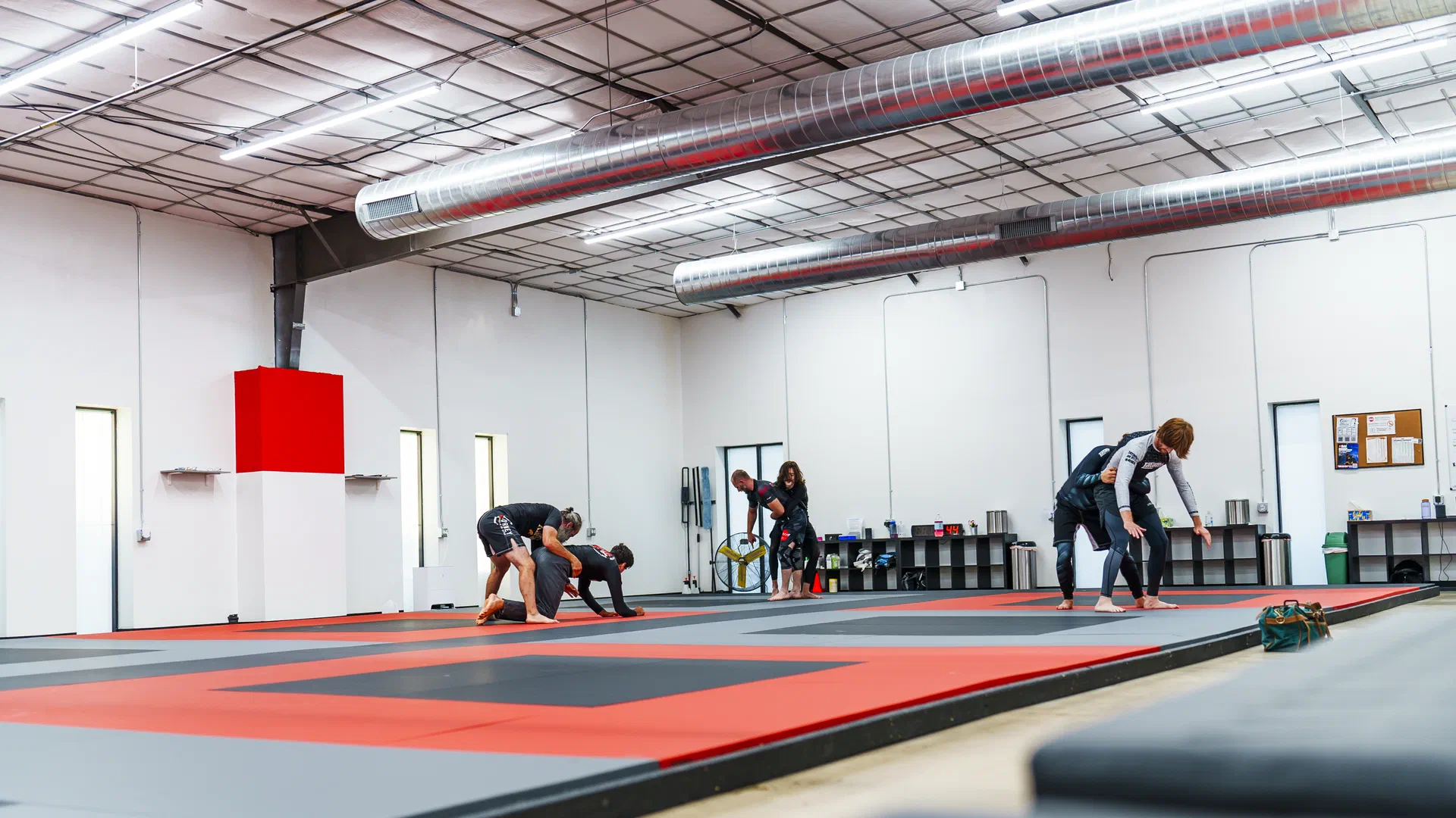 Wide view of Journey BJJ Academy training area in Madison Wisconsin showing premium mats and equipment
