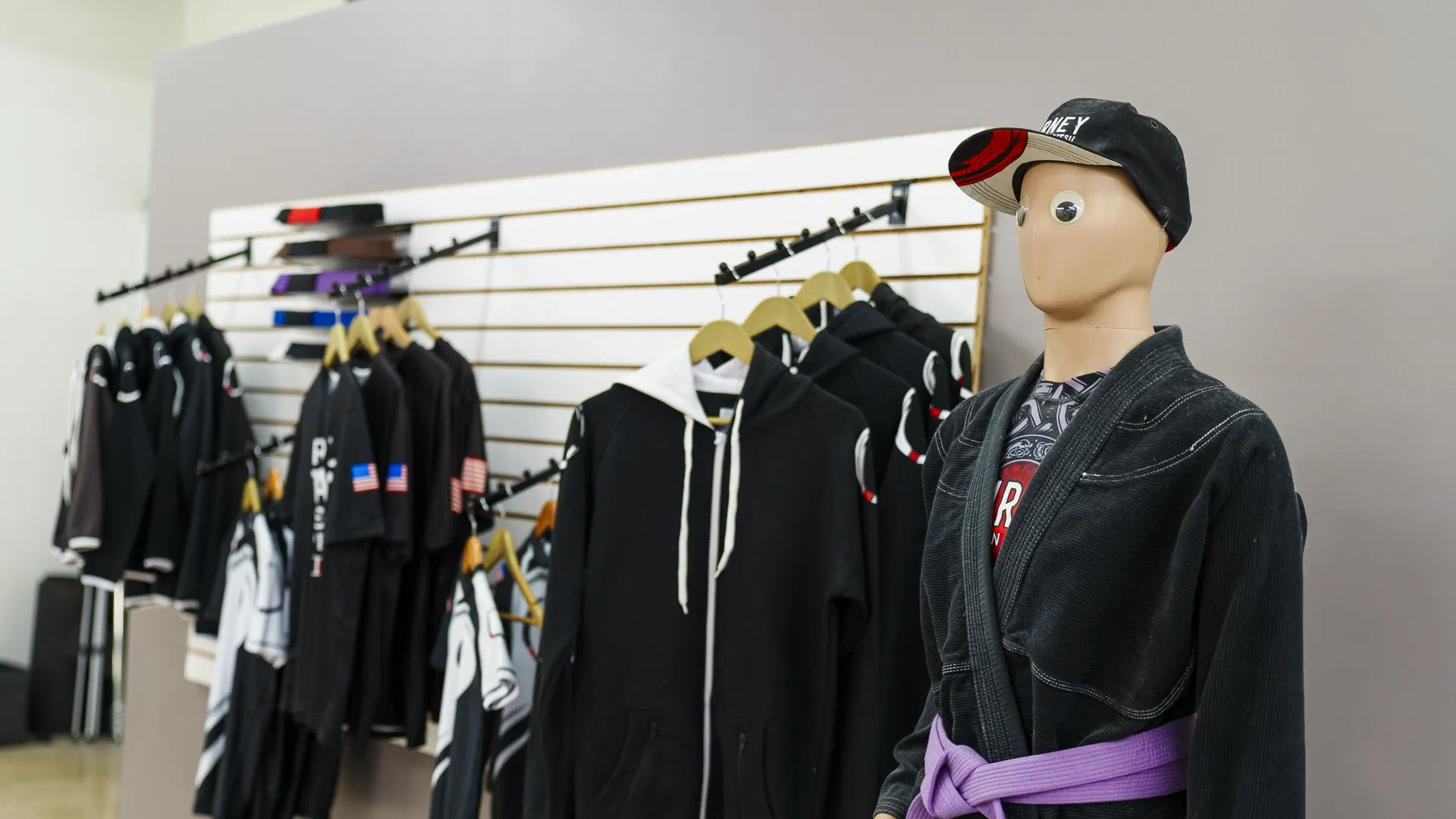 Pro shop and gear area within Journey BJJ Academy facility in Madison
