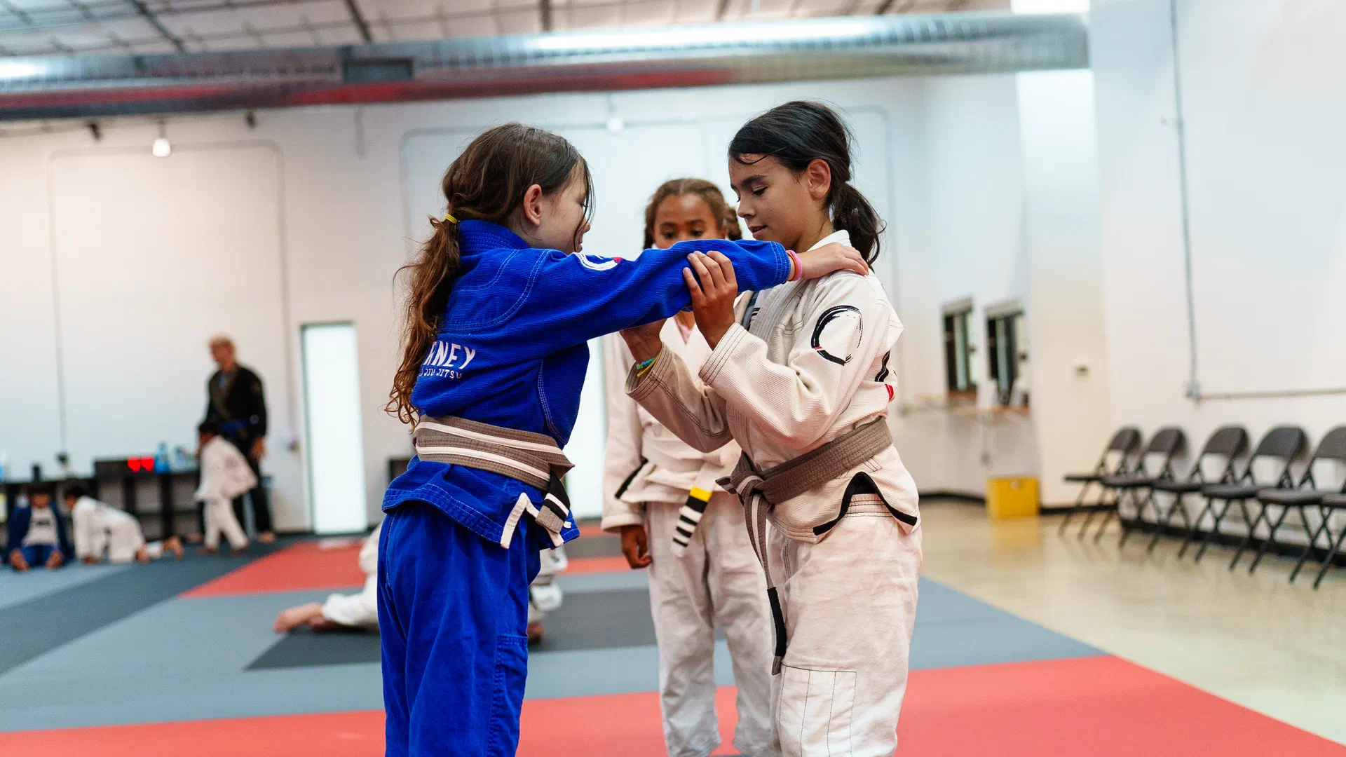 Girls training standing position at Journey BJJ Madison
