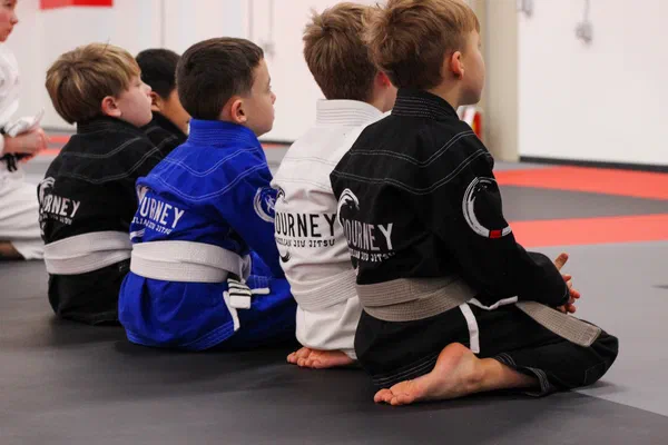 Kids BJJ class sitting attentively at Journey Academy Madison