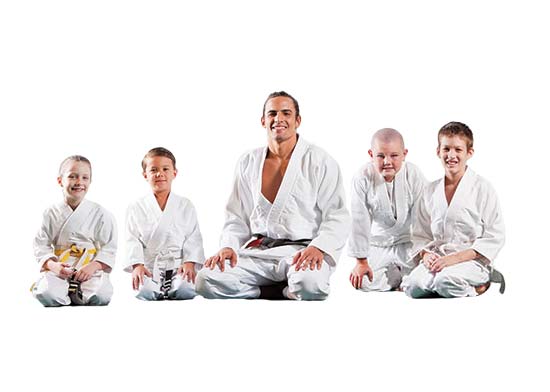 image of kids jiu jitsu instructor sitting with other kids image of kids jiu jitsu instructor sitting with other kids